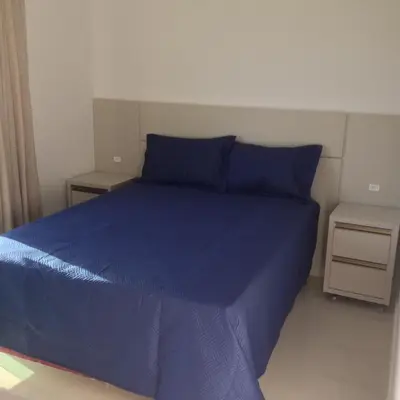 Uma cama ou camas num quarto em Palmas Paradise