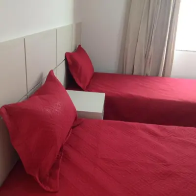Uma cama ou camas num quarto em Palmas Paradise