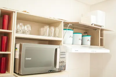 A cozinha ou kitchenette de temporadabombinhas 2 suítes