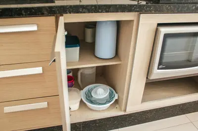A cozinha ou kitchenette de temporadabombinhas 2 suítes