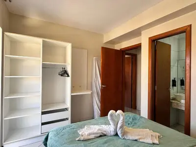 Uma cama ou camas num quarto em Residencial 364 - Localização privilegiada à 5min da praia