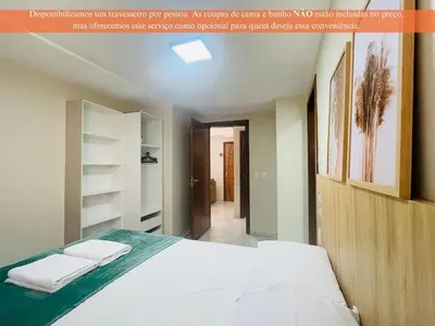 Uma cama ou camas num quarto em Residencial 364 - Localização privilegiada à 5min da praia