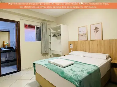 Uma cama ou camas num quarto em Residencial 364 - Localização privilegiada à 5min da praia