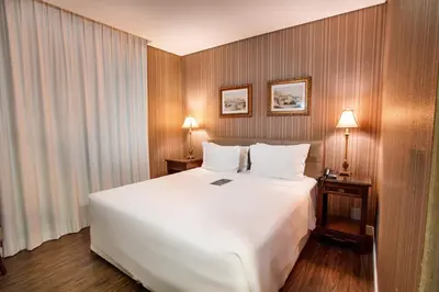 Uma cama ou camas num quarto em Sofistic Hotel
