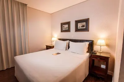 Uma cama ou camas num quarto em Sofistic Hotel
