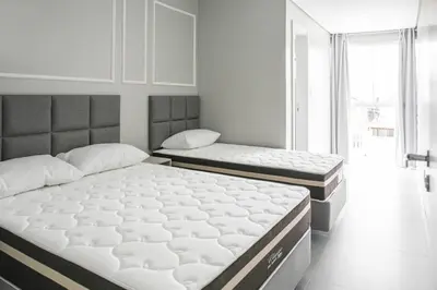 Uma cama ou camas num quarto em Edifício Algarve