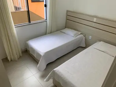 Uma cama ou camas num quarto em Res. Estoril