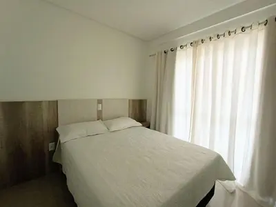 Uma cama ou camas num quarto em Residencial Natália