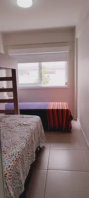 Uma cama ou camas num quarto em Praia de Palmas Ville