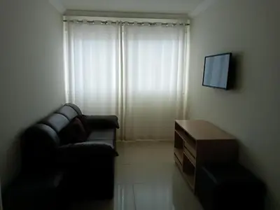 Uma área de estar em Apartamento frente ao mar
