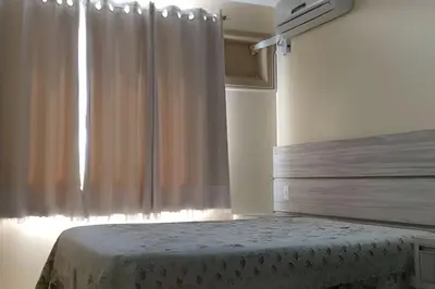 Uma cama ou camas num quarto em Apartamento com Vista para o Mar, Residencial Vista Bella