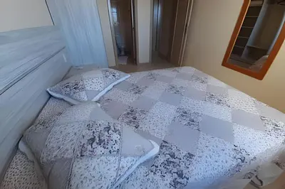 Uma cama ou camas num quarto em Apartamento com Vista para o Mar, Residencial Vista Bella