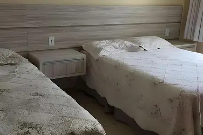 Uma cama ou camas num quarto em Apartamento com Vista para o Mar, Residencial Vista Bella