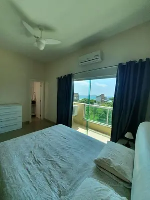 Uma cama ou camas num quarto em Cobertura Jacuzzi Vista Mar