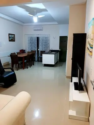 Uma televisão e/ou sistema de entretenimento em Cobertura Jacuzzi Vista Mar