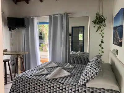 Uma cama ou camas num quarto em Pousada Canario Azul