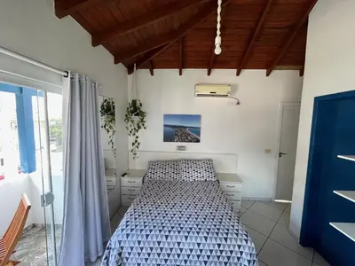 Uma cama ou camas num quarto em Pousada Canario Azul
