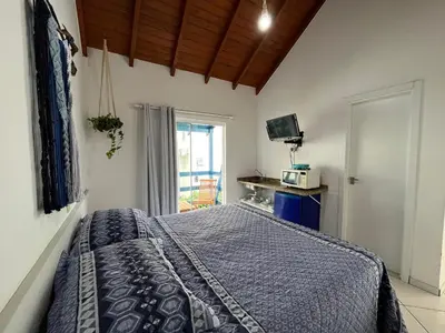 Uma cama ou camas num quarto em Pousada Canario Azul