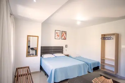 Uma cama ou camas num quarto em Pousada Casa de Praia