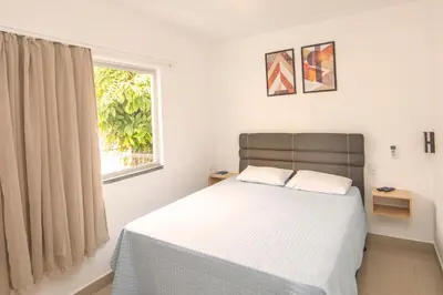 Uma cama ou camas num quarto em Pousada Casa de Praia