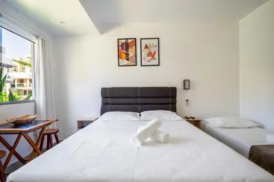 Uma cama ou camas num quarto em Pousada Casa de Praia
