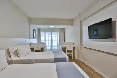 Uma cama ou camas num quarto em Itapema Beach Hotel & Convention