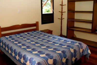Uma cama ou camas num quarto em Pousada e Residencial Canto Verde...a uma quadra da melhor praia...
