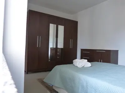 Uma cama ou camas num quarto em 150m da Praia Pereque, 3 quartos, Amplo e Aconchegante