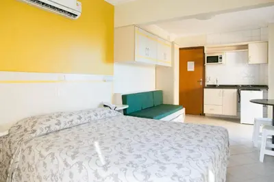 A cozinha ou kitchenette de Bombinhas Praia Apart Hotel - unidade rua Bem Te Vi