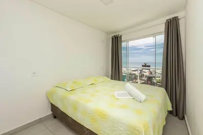 Uma cama ou camas num quarto em Sobrado frente ao mar Mariscal 4 Pessoas