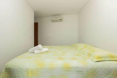 Uma cama ou camas num quarto em Sobrado frente ao mar Mariscal 4 Pessoas
