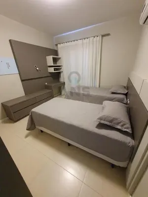 Uma cama ou camas num quarto em ANSNEGOCIOS APTO CHARMOSO PRAIA MARISCAL 101 Italy