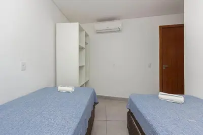 Uma cama ou camas num quarto em Sobrado frente ao Mar 4 pessoas
