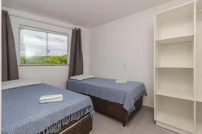 Uma cama ou camas num quarto em Sobrado frente ao Mar 4 pessoas