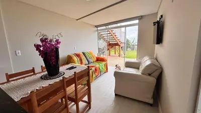 Uma área de estar em Apartamentos Frente ao Mar