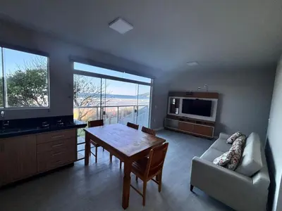 Uma televisão e/ou sistema de entretenimento em Apartamentos Frente ao Mar