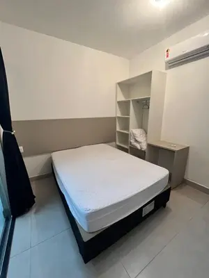 Uma cama ou camas num quarto em RESIDENCIAL FLAMINI