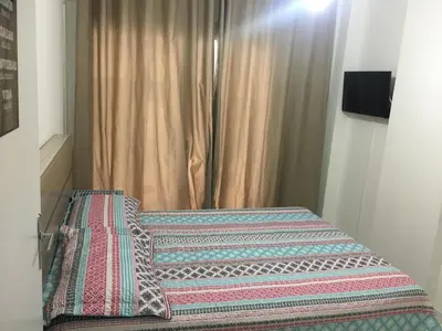 Uma cama ou camas num quarto em Balneário Camboriú lindo apto proximo Mar