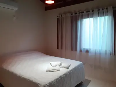 Uma cama ou camas num quarto em Vila Figueiredo das Donas