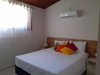 Uma cama ou camas num quarto em Vila Figueiredo das Donas