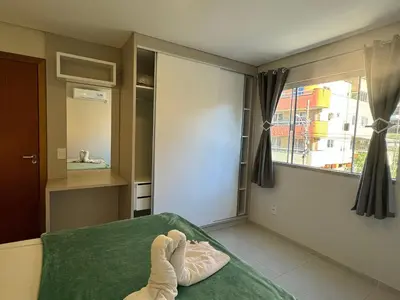 Uma cama ou camas num quarto em Residencial 287 - Localização privilegiada à 5min da praia
