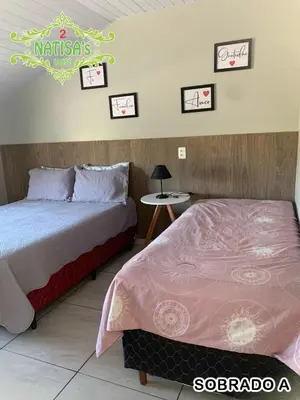 Uma cama ou camas num quarto em Sobrados aconchegante com piscina 
