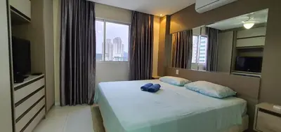 Uma cama ou camas num quarto em Camburiu Home 2004