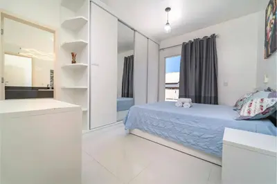 Uma cama ou camas num quarto em Casa de Praia em Bombinhas Beach House