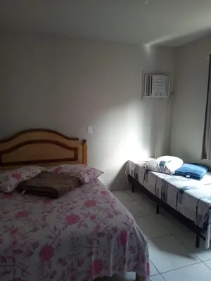 Uma cama ou camas num quarto em Aluguel casa Bombinhas