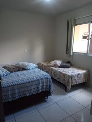 Uma cama ou camas num quarto em Aluguel casa Bombinhas