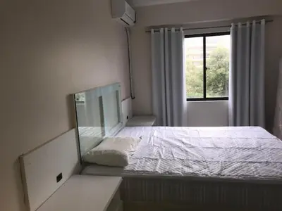 Uma cama ou camas num quarto em Vista para o Mar a 180 m da Praia