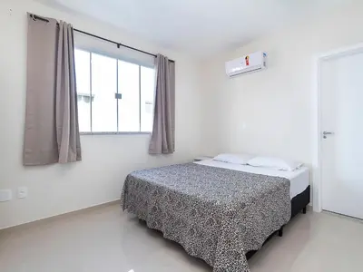 Uma cama ou camas num quarto em Apartamento com suíte para 6 pessoas – Bombas