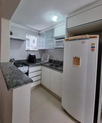 A cozinha ou kitchenette de Apartamentos próximo à praia