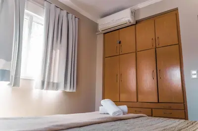 Uma cama ou camas num quarto em #001 Casa show beach tennis 50 m praia de Palmas